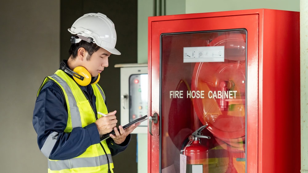 Fire safety training, firefighter inspection, fire alarm system check, industrial safety, emergency readiness, fire prevention protocol.
